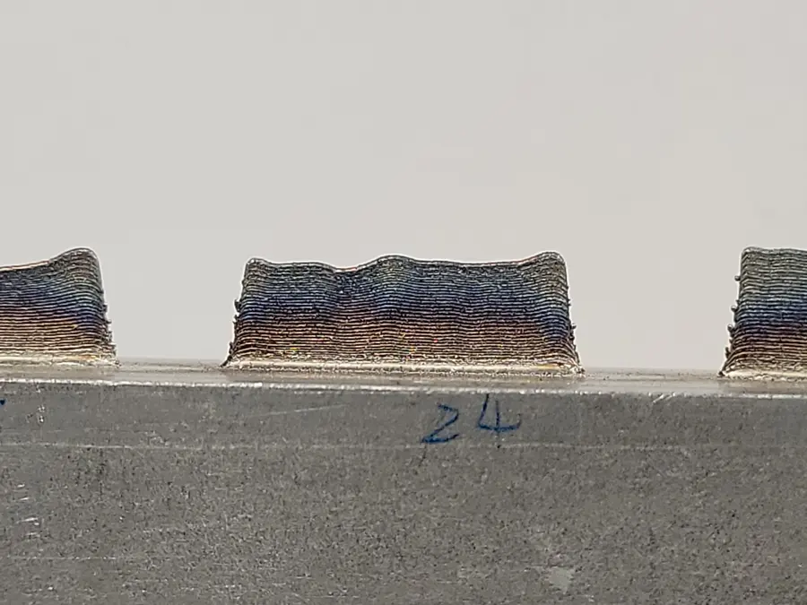 As-built wall — wavy top. Layer-height drift accumulating over a build, and an objective worth optimizing against.