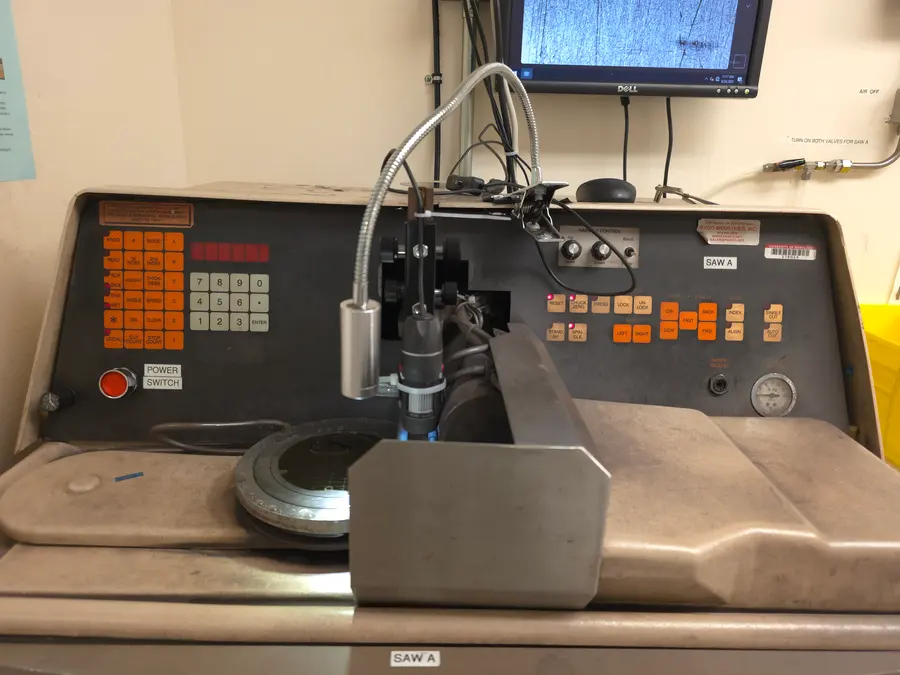 Dicing saw. Cleanroom wafer dicing, one street at a time.