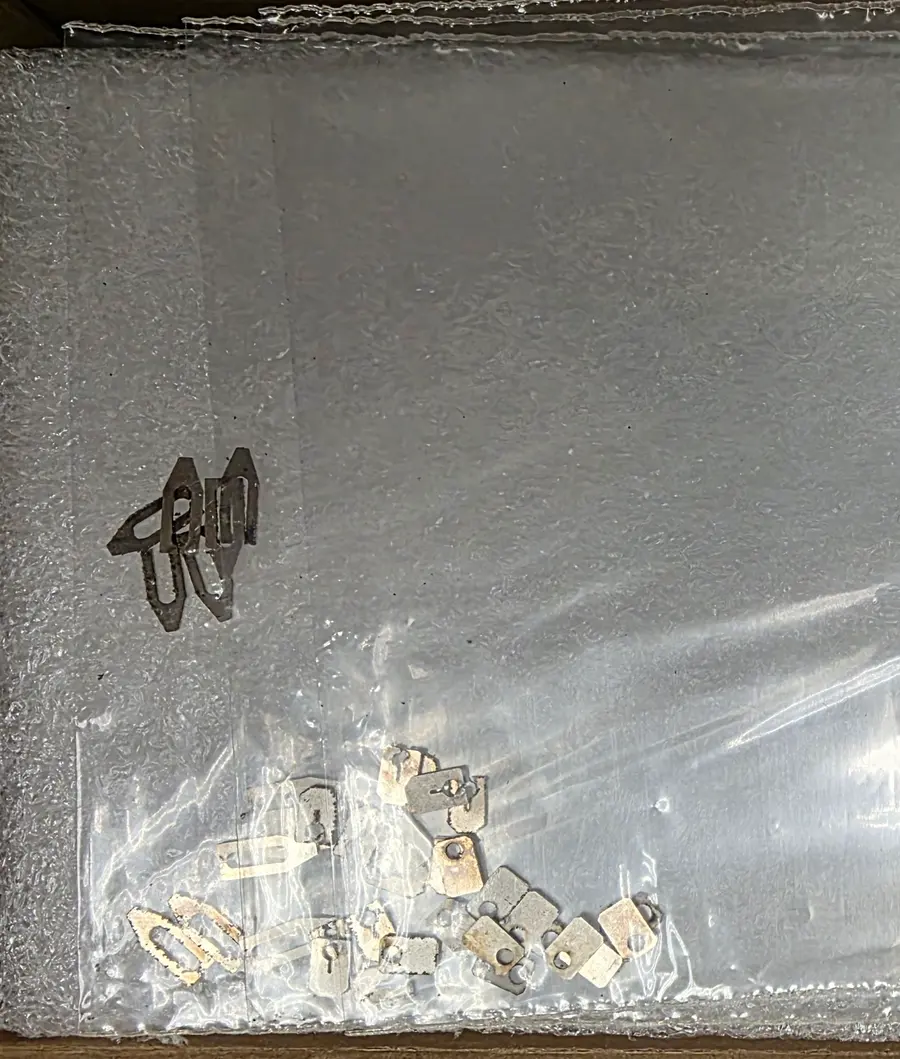Laser-cut parts. Custom fixtures, cut in-house, for a one-off experiment.