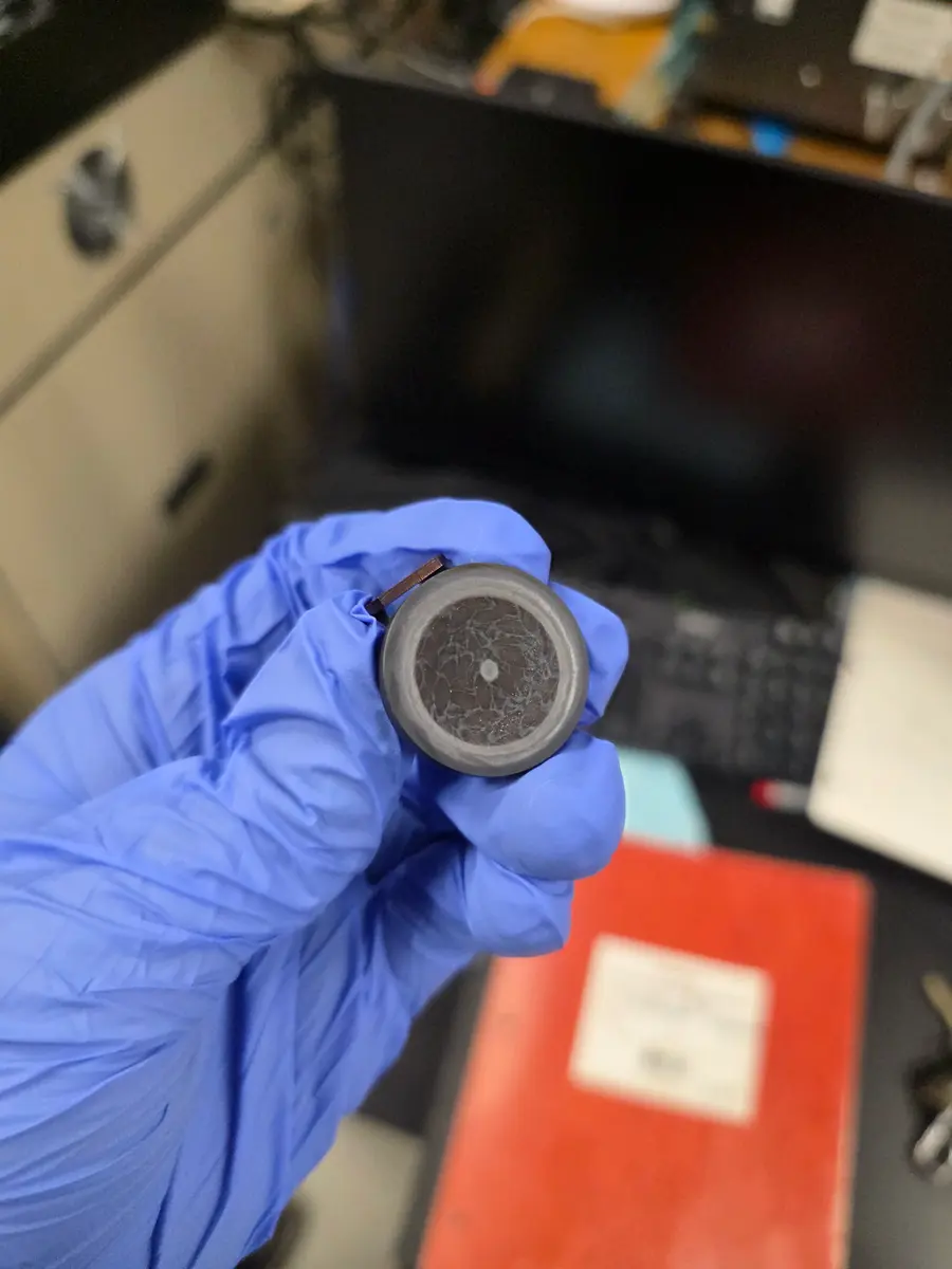 A PLD target. Every film starts as a pressed and sintered puck like this one.